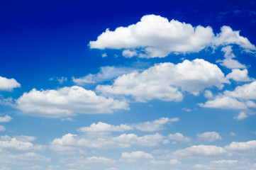 The blue sky and beautiful white clouds.