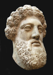 Ancient Greek bust of bearded man, black background