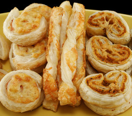 Savory pastries including cheese straws, ham and cheese scrolls