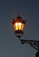 Fototapeta na wymiar Old lamp in early evening