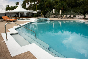 swimming pool with loungers with no people in sight