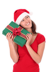 Woman in Santa hat holding gift box