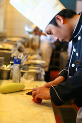 chef cooking, cutting in kitchen