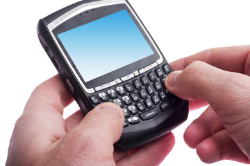 close up of hands typing on a Blackberry
