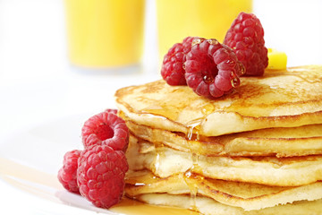 Pancake stack with fresh raspberries