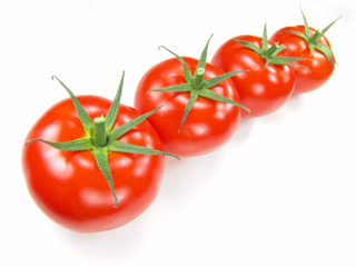 Isolated fresh tomatoes with stems close-up (vivid colors)