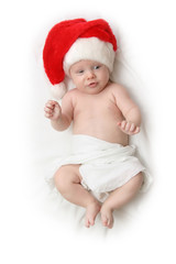 The Child in red hat of Santa on white background.
