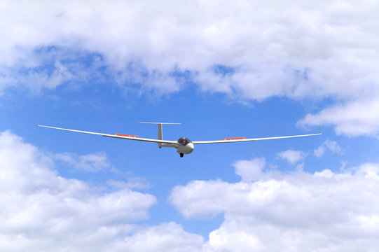 Modern glider in flight coming into land.