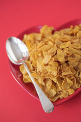 Cornflakes & spoon on a heart shaped plate