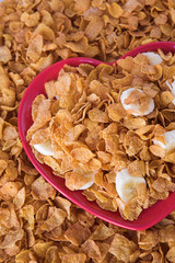 Cornflakes & sliced banana on a heart shaped plate