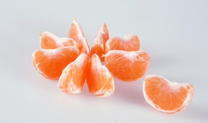 slices of tangerine on white background