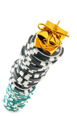 Stack of casino chips with golden box on the top