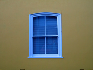 blue window, ochre wall