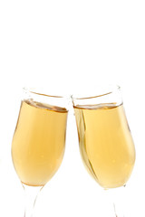 Celebration toast with champagne on white