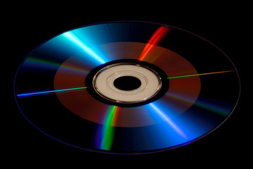 DVD / CD-ROM Disk Isolated on Black, With Radiating Rays