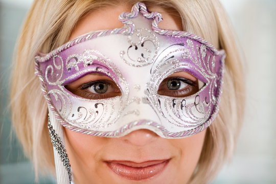 blonde women with carnival mask, close-up
