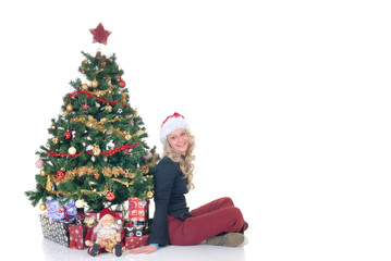 Smiling teenage girl next to Xmas, Christmas three  