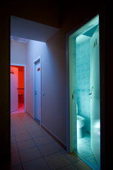 Mysterious corridor and opened door to toilet.