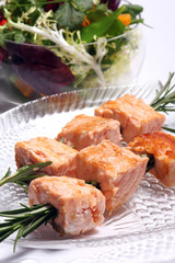 Salmon grilled on the rosemary skewers with vegetables