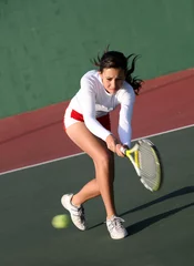 Foto op Canvas Teenage girl playing tennis © Galina Barskaya