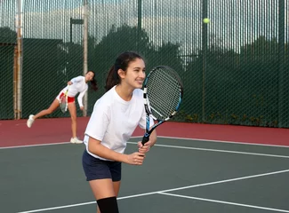 Foto op Plexiglas Two girls playing tennis © Galina Barskaya