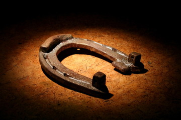 Old iron horseshoe on the ground