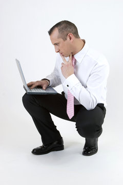 businessman with a computer on white background