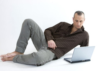 young man with a laptop on white background
