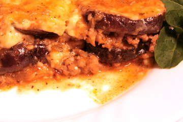 Lamb moussaka with egg plan; cheese and herbs