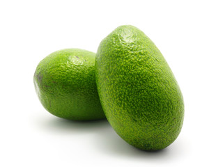 two avocados isolated on white background