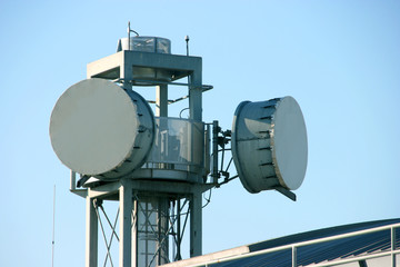 Communication tower and satellite antennas transmitting encrypted data information