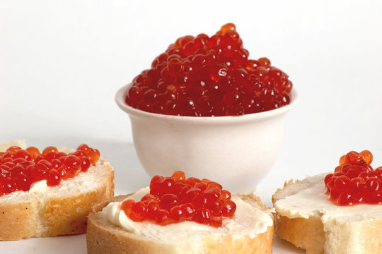An image of sandwich with red caviar