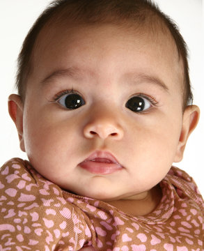close up of a beautiful three month old hispanic baby girl