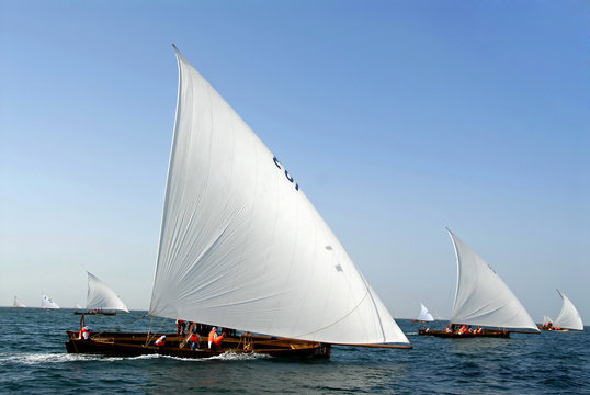 Arabic Wooden Sailing Dhows Spread Throughout The Ocean