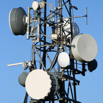 Microwave dishes on communication tower