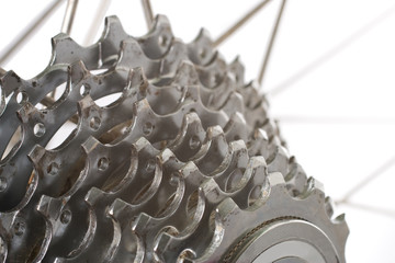 A worn nine speed bicycle chain gear cassette