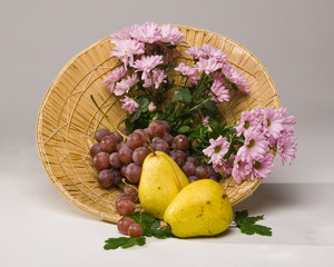 Basket with fruit and flowers
