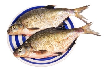 Fototapeta premium two fishes on plate isolated on white