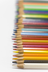 colorful pencils on white background in horizontal position