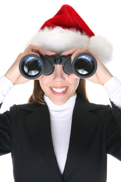 A Pretty Business Woman With Binoculars At Christmas