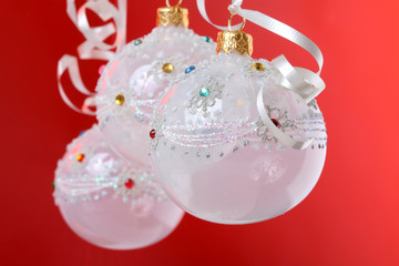 christmas still life with white balls on red background