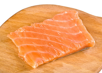 Salmon fillet on a carving board