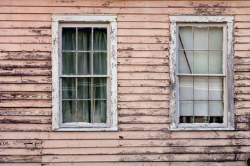 Fototapeta na wymiar Image of weathered southern home with two windows