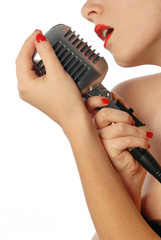 Woman singing with vintage microphone