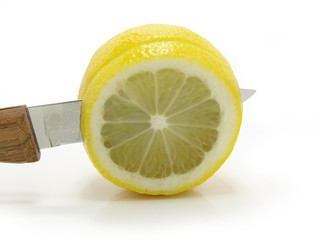 Fresh lemon knife on a white background.