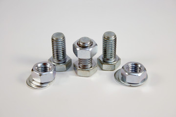 nuts and bolts over a white background