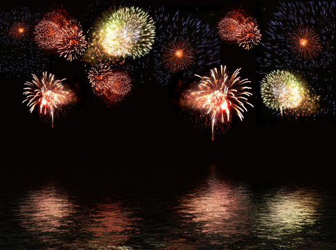 fireworks display during a holiday celebration over water