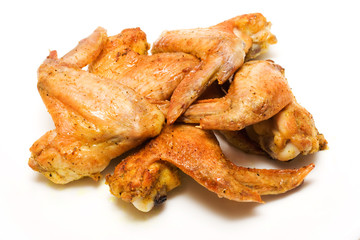 Grilled chicken wings on white background