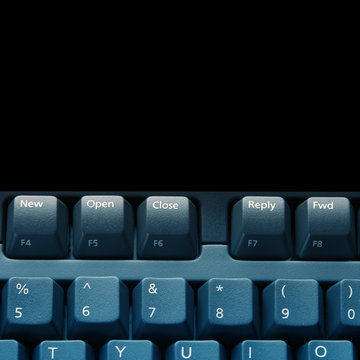 Close-up of wireless keyboard keys on black background