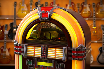 jukebox in front of guitars - selective focus on jukebox
